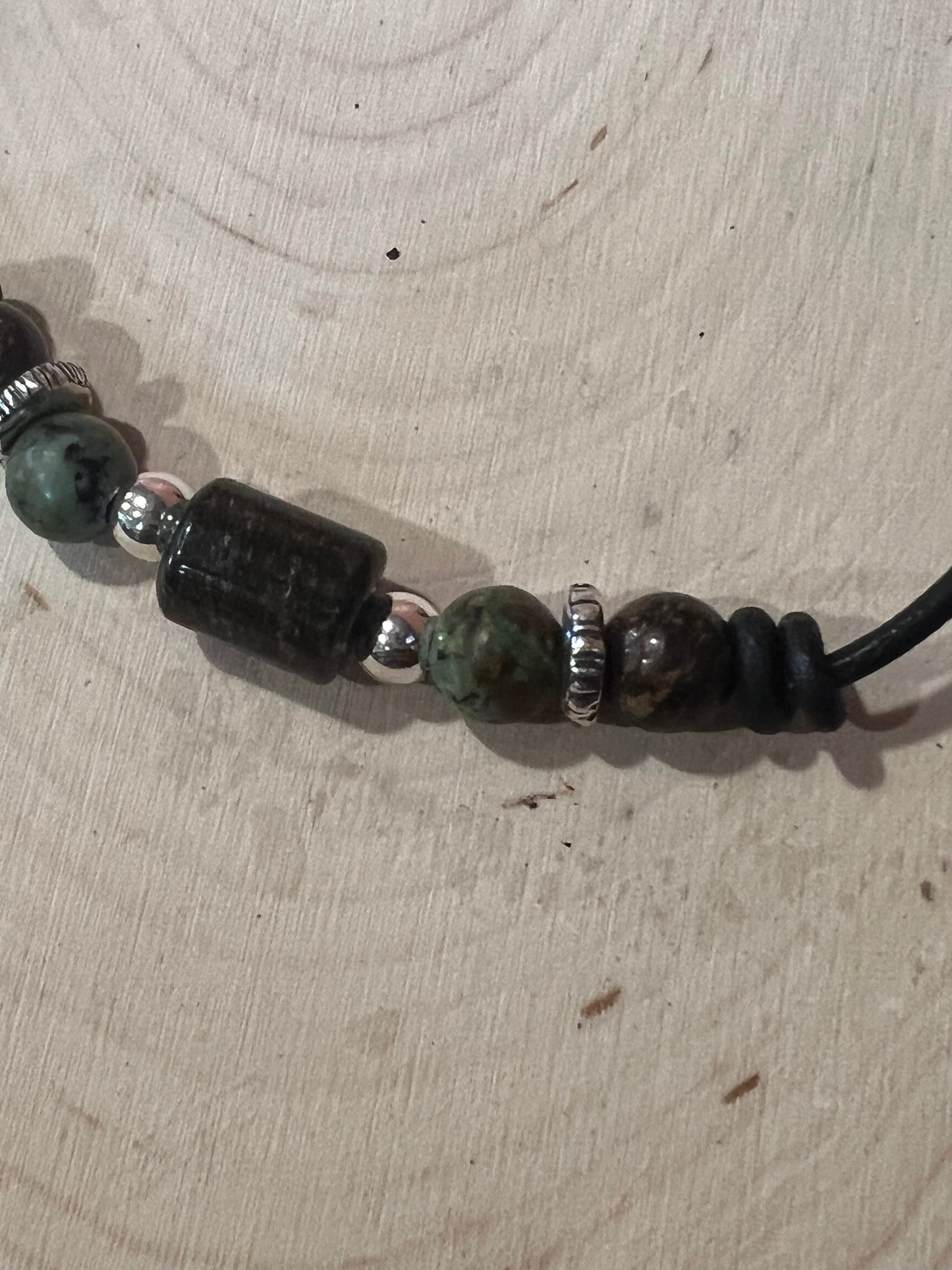 Bronzite, African turquoise and sterling silver on leather cord